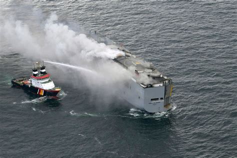 A fire on a ship carrying nearly 3,000 cars is burning in the North Sea and 1 crew member has died